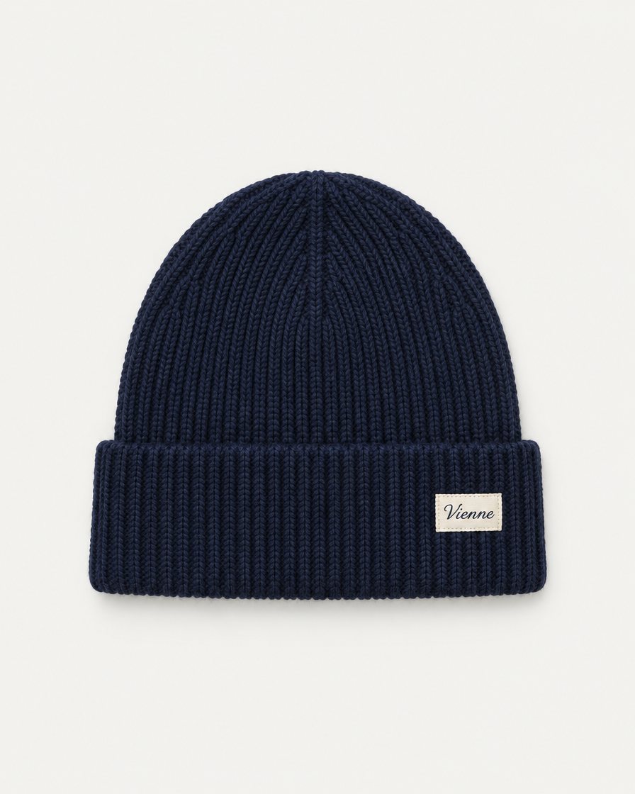 Concept render: ink navy rib knit beanie with a woven Vienne label