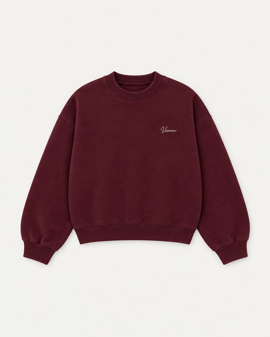 Concept render: oxblood crewneck with a small Vienne script