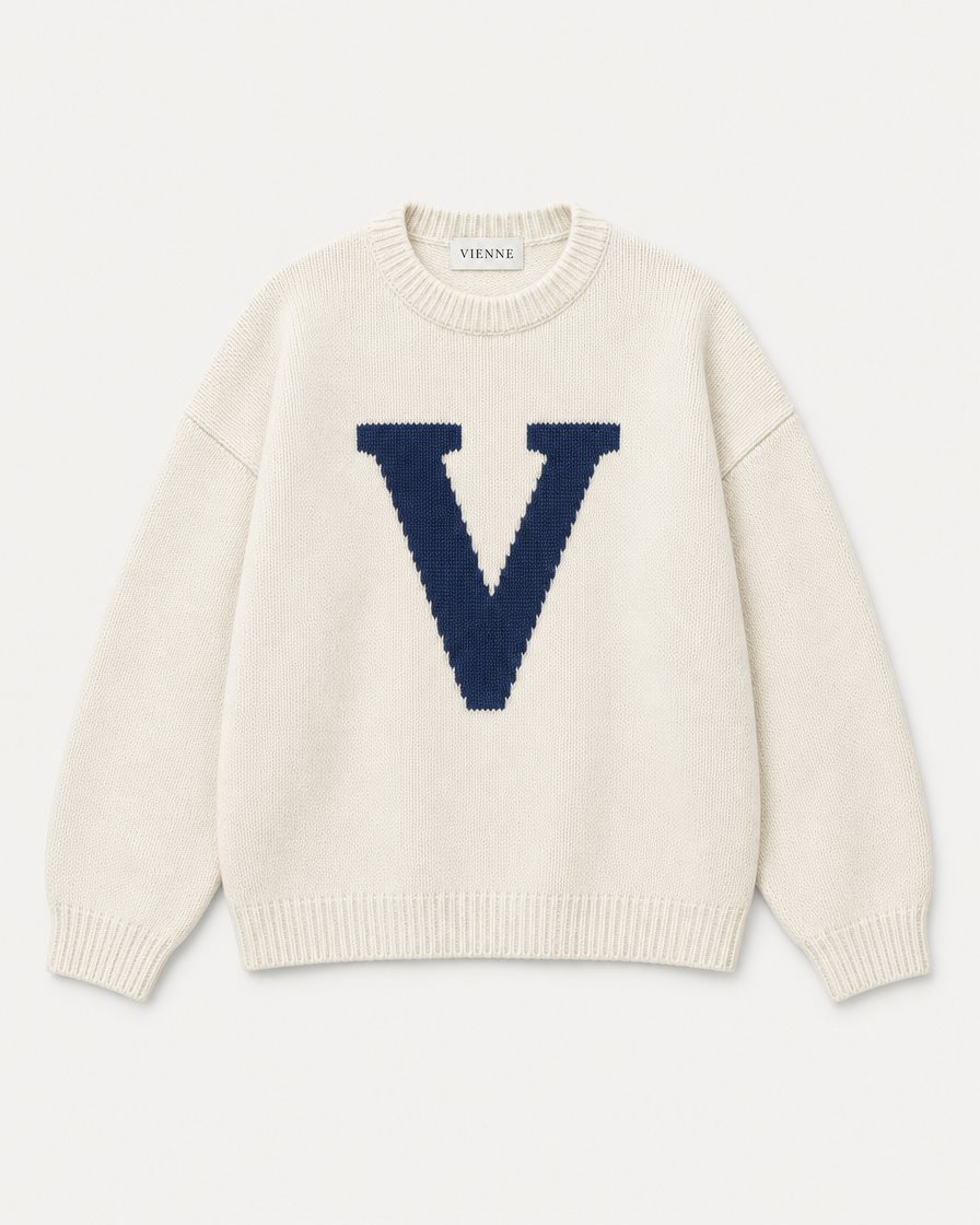 Concept render: bone knit sweater with a big navy V on the chest