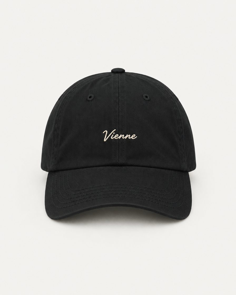 Concept render: black cap with Vienne embroidered in cream script