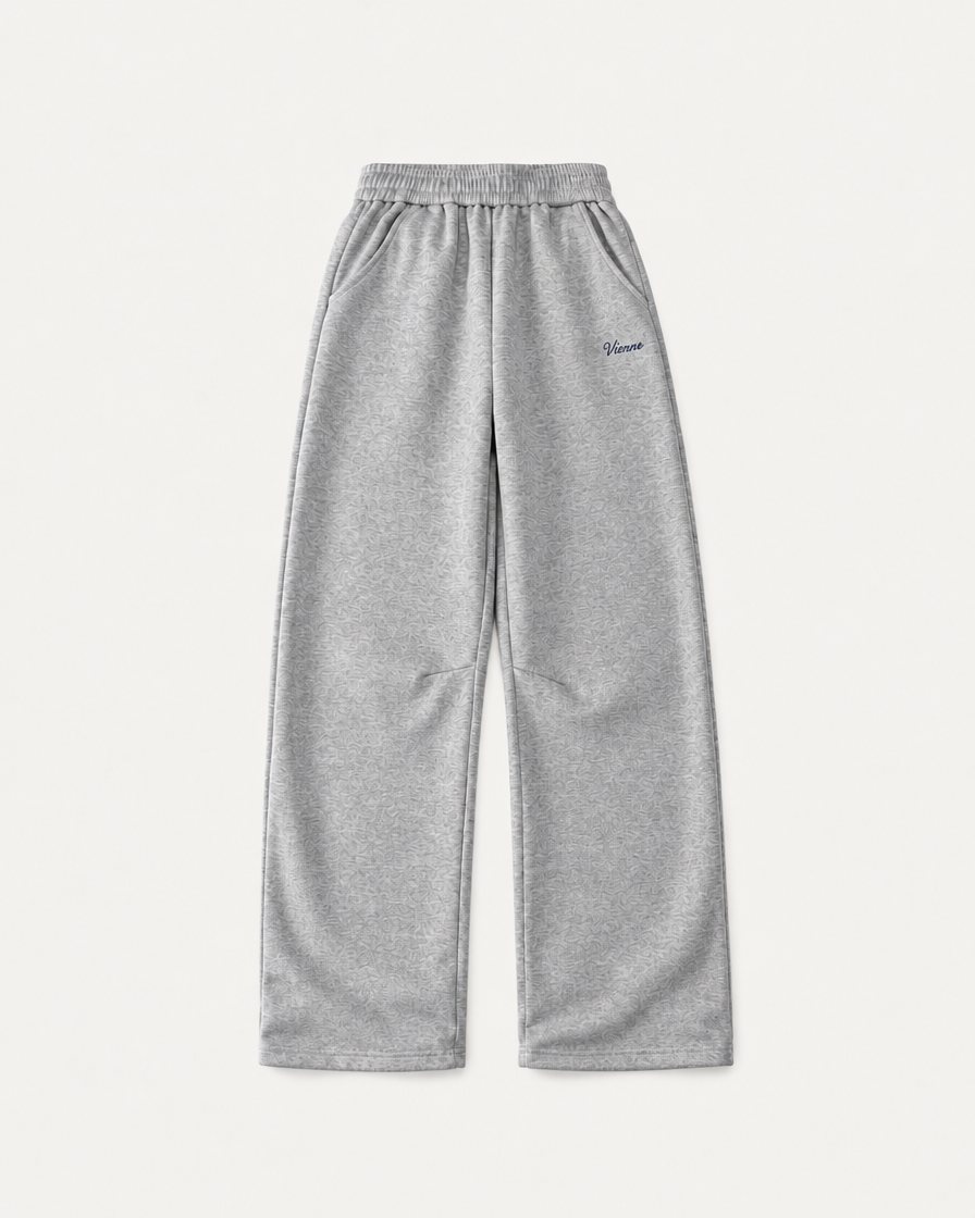 Concept image: heather grey Bonbon Sweatpant with a small Vienne script on the thigh, front